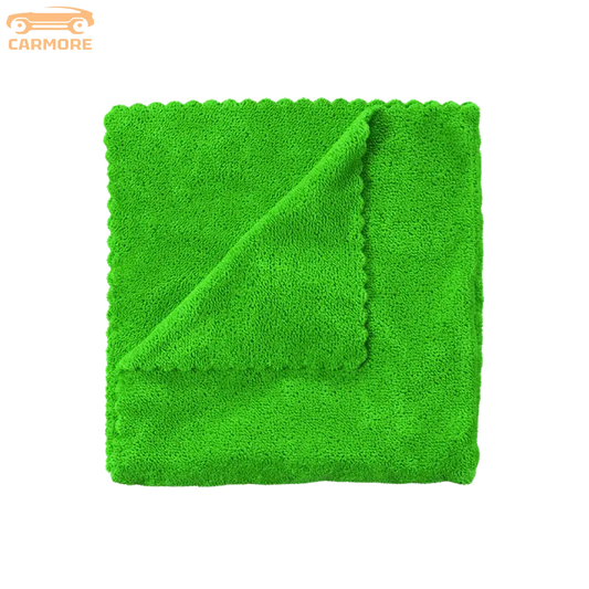 Bright green microfiber cleaning cloth with textured surface and folded corner