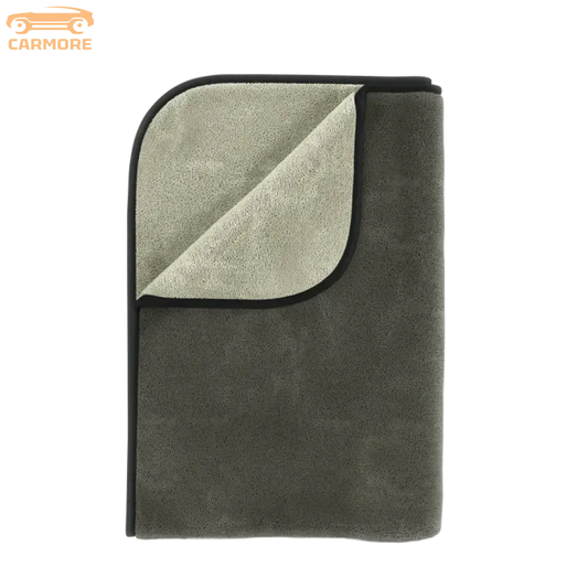 Folded microfiber towel in muted gray and light gray with black trim