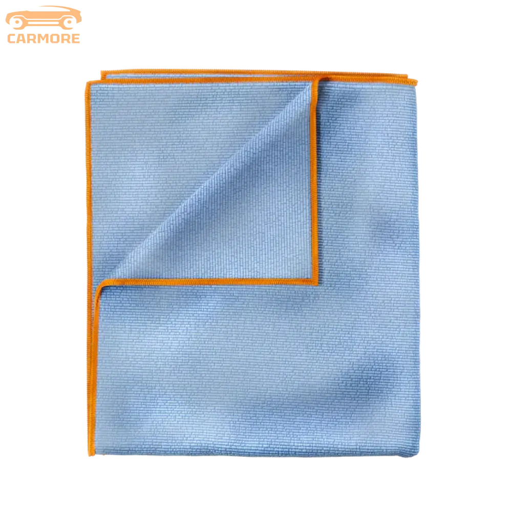 Blue microfiber towel with orange trim folded to show texture and edges