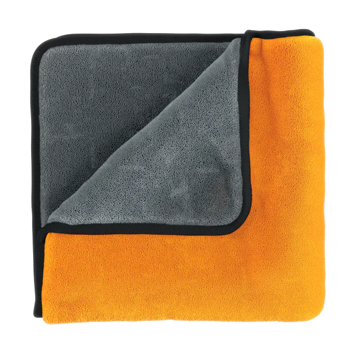 Soft microfiber towel with gray and bright orange reversible sides and black trim