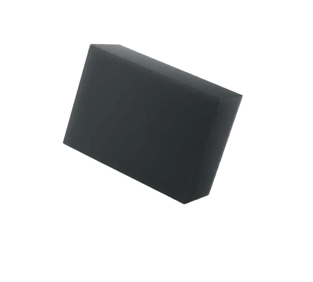 Black rectangular foam tire pad angled on white background, durable texture