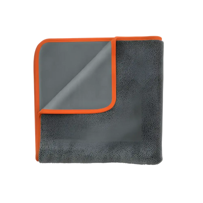 Folded dark gray microfiber car drying towel with orange trim on white background