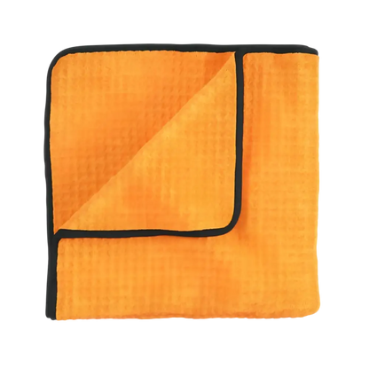 Orange microfiber cleaning towel with black edge trim, folded showing textured surface