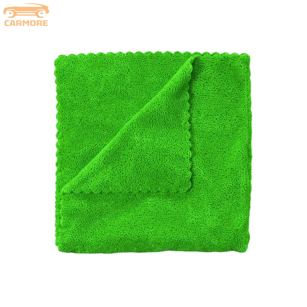 Bright green microfiber cleaning cloth with textured surface and folded corner
