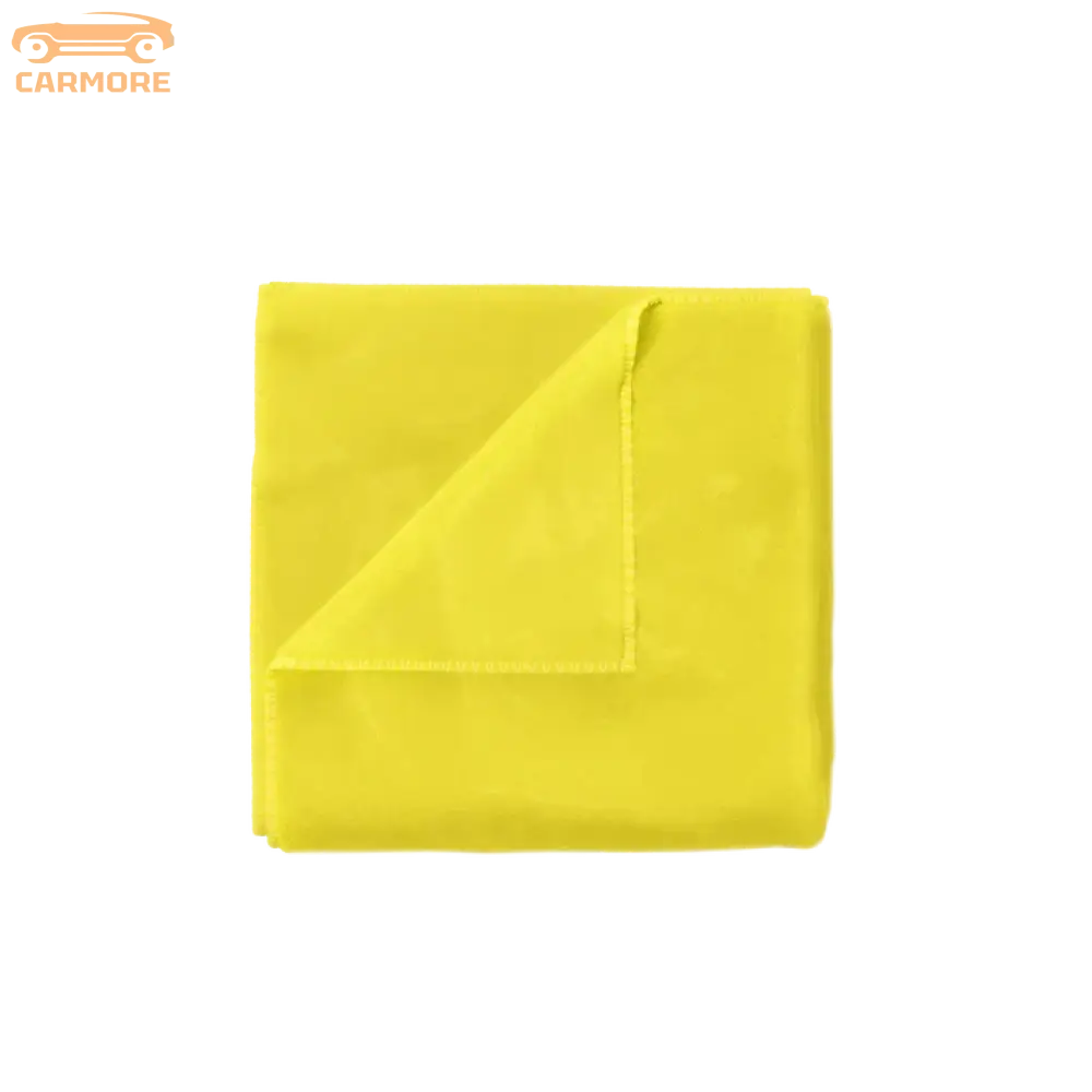 Bright yellow microfiber cleaning towel folded with one corner lifted showing soft texture