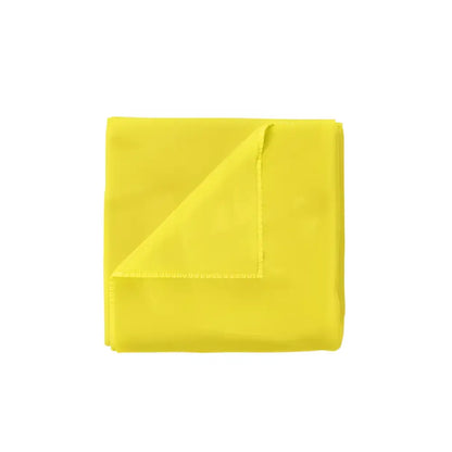Bright yellow microfiber cleaning towel folded with one corner lifted showing soft texture