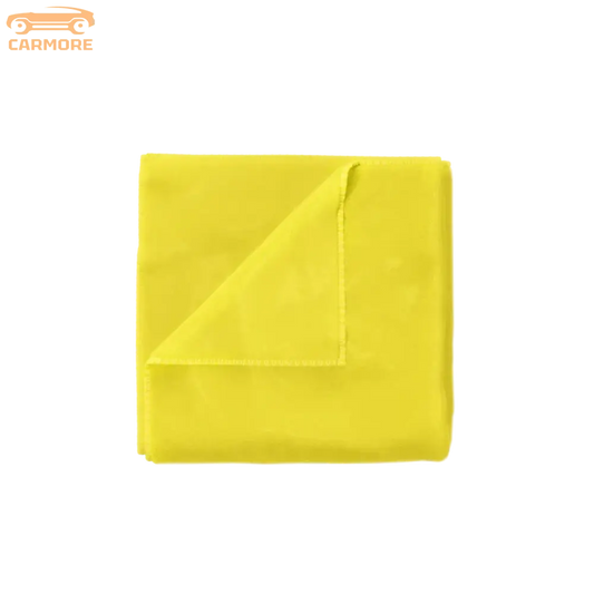 Bright yellow microfiber cleaning towel folded with one corner lifted showing soft texture