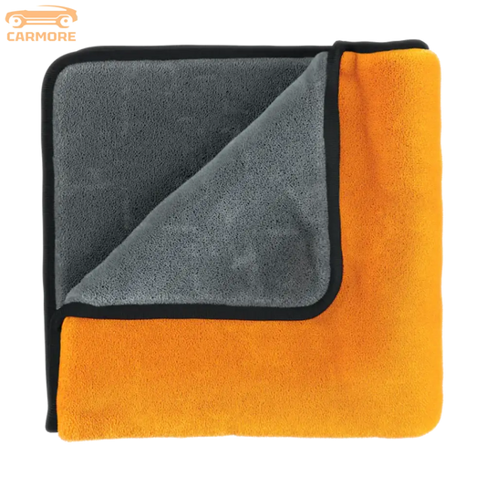 Soft dual-sided microfiber towel with orange and gray sides and black trim