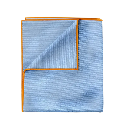 Blue microfiber towel with orange trim folded to show texture and edges