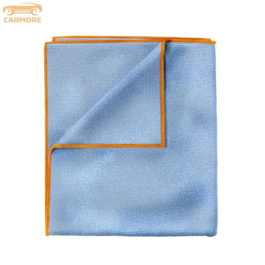 Blue microfiber towel with orange trim folded to show texture and edges
